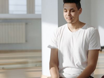 Calm person sitting in a meditation pose.
